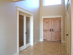 Wide entry feature cathedral ceiling with hanging chandelier...