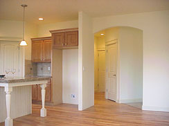 Kitchen features 2 arched doorways...