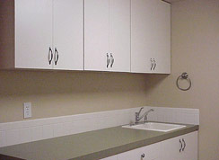 Spacious 12X8 laundry doubles as a craft room or sewing room