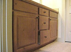 2nd level guest bath vanity made of Cherry wood & has two sinks