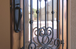 Rich wrought-iron door...