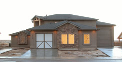 4 car garage features windows, 3 entry doors...