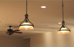 Stainless hanging lights over the breakfast bar...