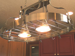 Hanging light with hooks to hang your pans... Perfect with center bar beneath...